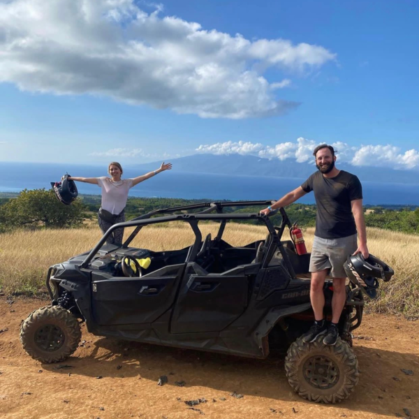 a man flying through the air while riding a bike down a dirt road