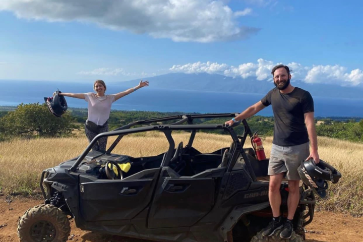 a man flying through the air while riding a bike down a dirt road