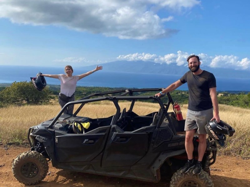 a man flying through the air while riding a bike down a dirt road