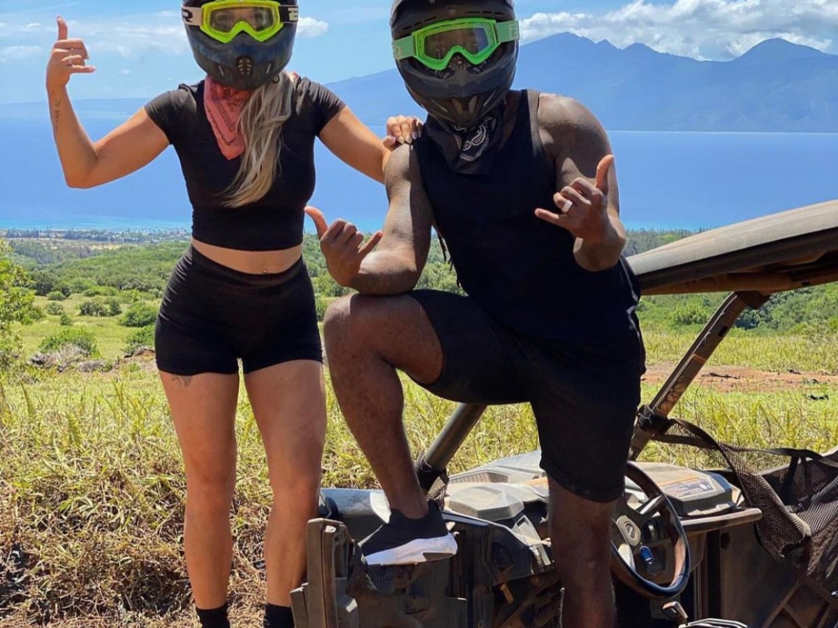 a group of people standing on a beach