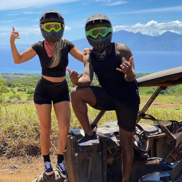 a group of people standing on a beach