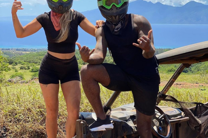 a group of people standing on a beach