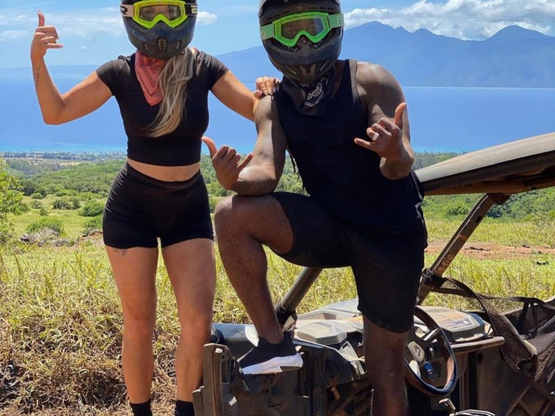a group of people standing on a beach